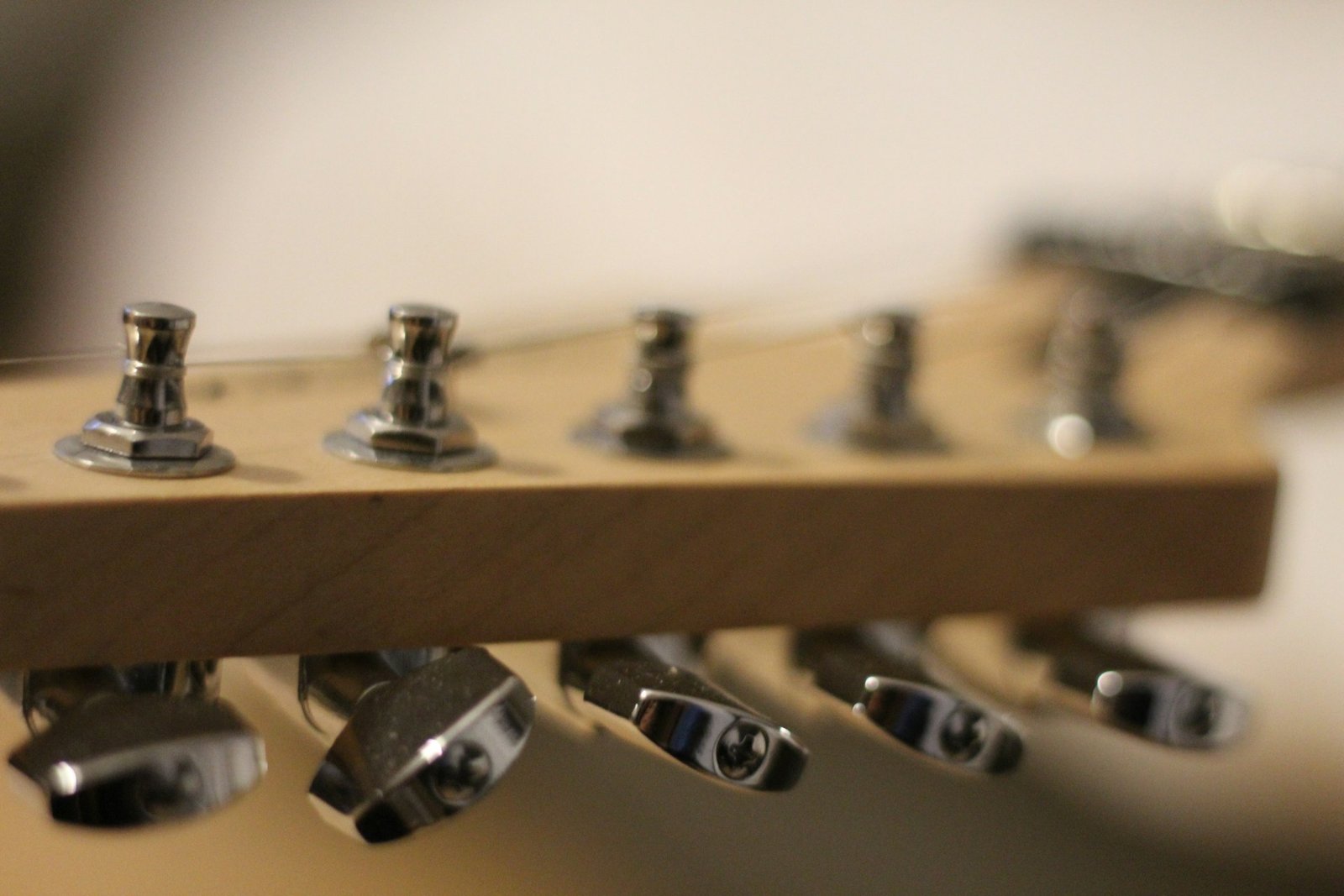 Close-up of tuning machines on a guitar headstock