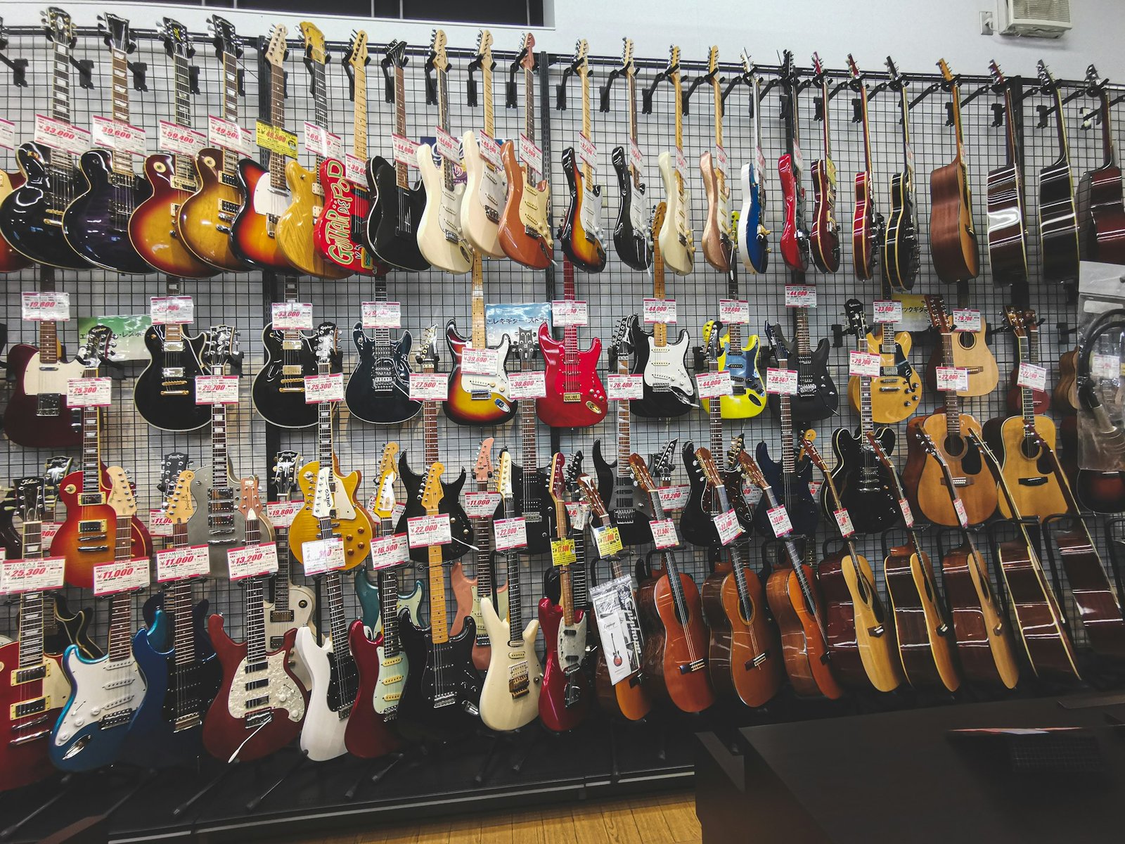 Rows of guitars on display